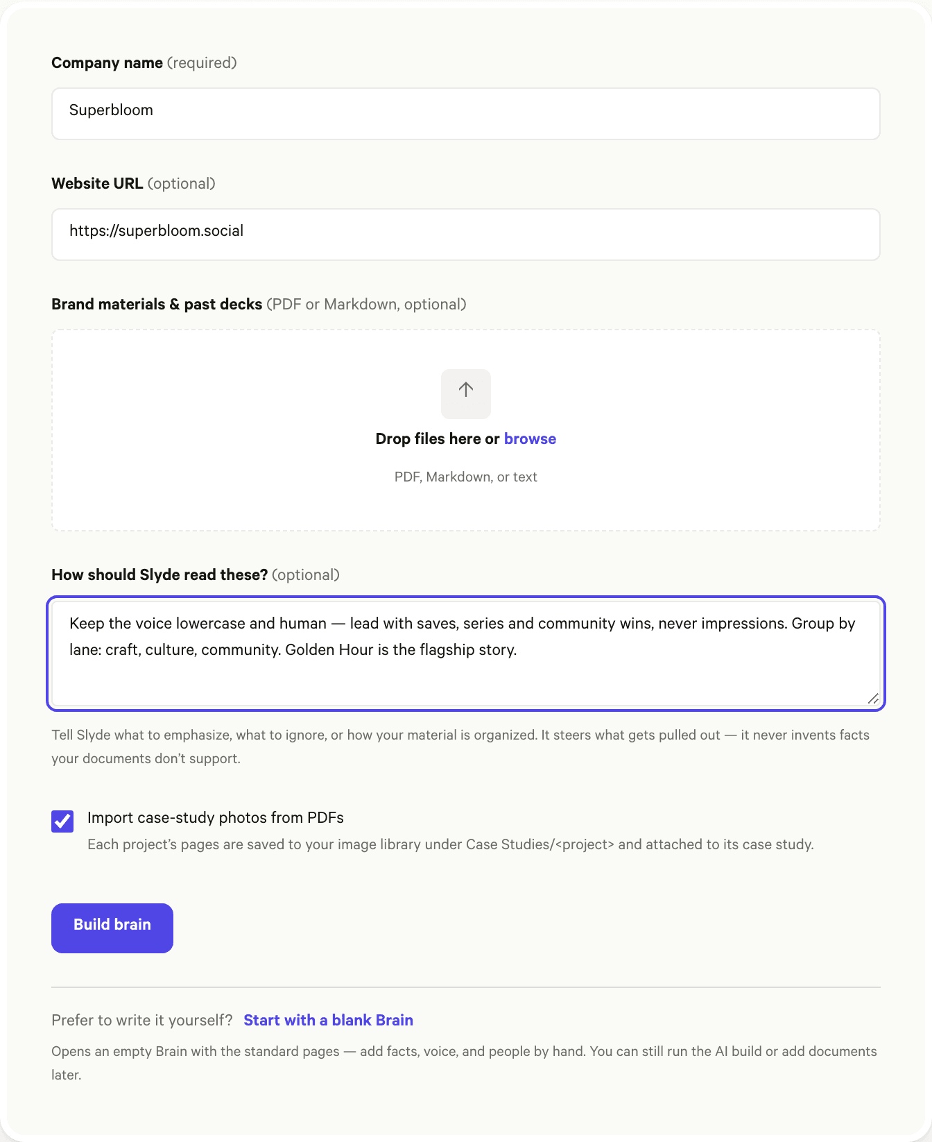 The Brain build form, filled in: company name, website URL, the document dropzone, the “How should Slyde read these?” guidance box, and the Build brain button